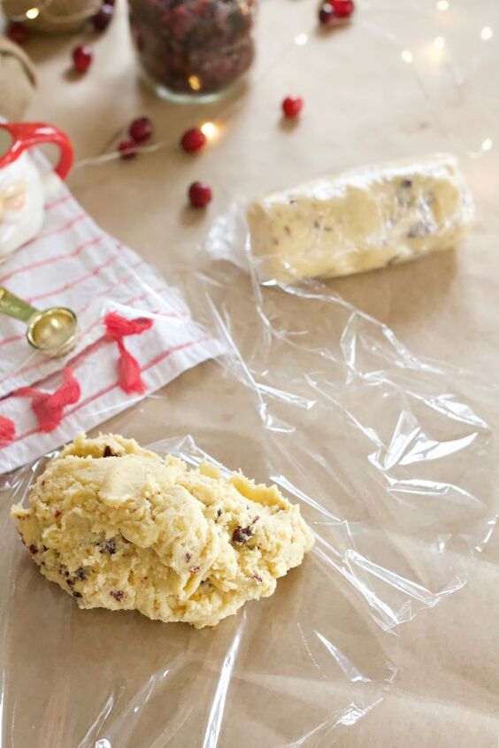 cranberry orange icebox cookies with orange zest drizzle, Cookie dough on a counter being rolled up in plastic wrap