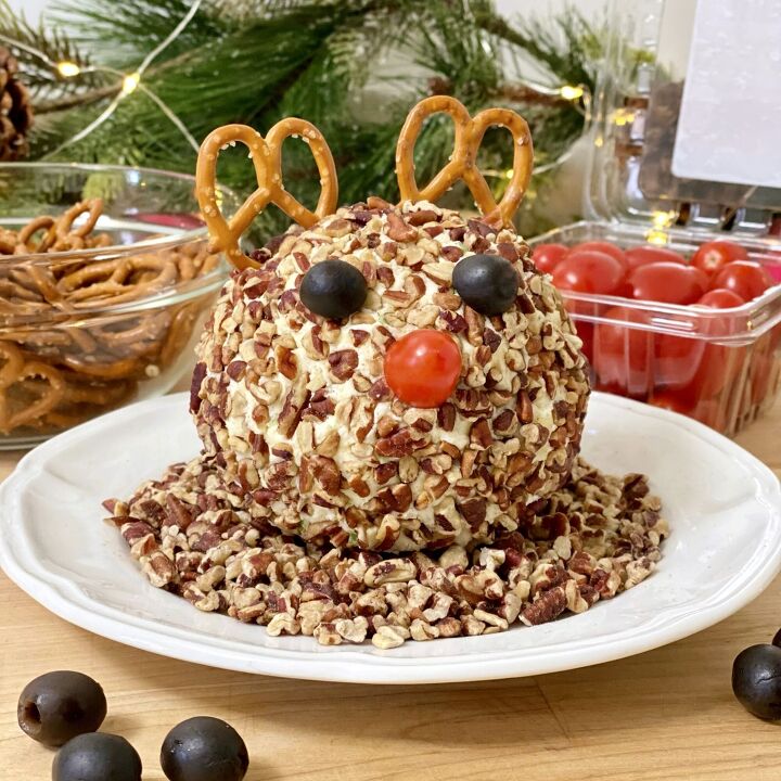 rudolph christmas cheese ball, Rudolph Christmas Cheese Balll non a plate with pecans Pretzels and grape tomatoes are in the background