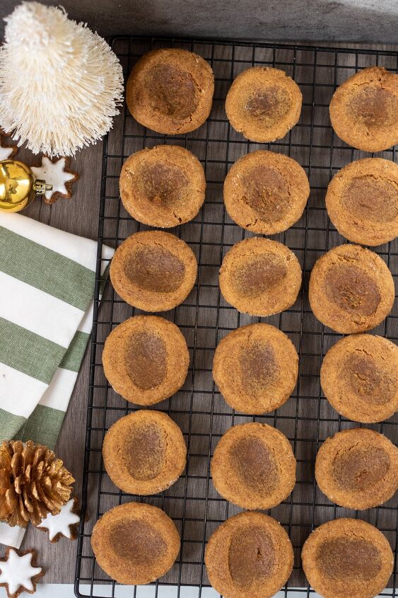 gingerbread mocha thumbprint cookies, A cooling rack topped with 3 rows of gingerbread thumbprint cookies right after coming out of the oven