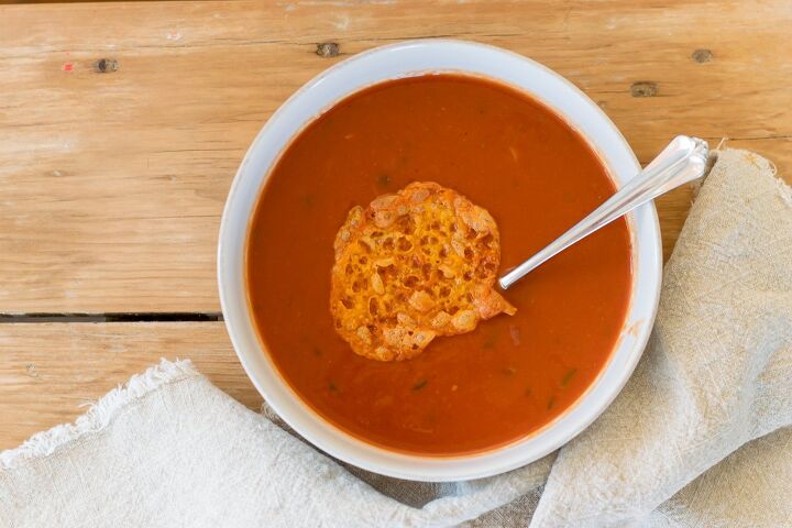 healthy homemade tomato soup very low fat, Healthy Homemade Tomato Soup in white bowl with cheese crisp on top