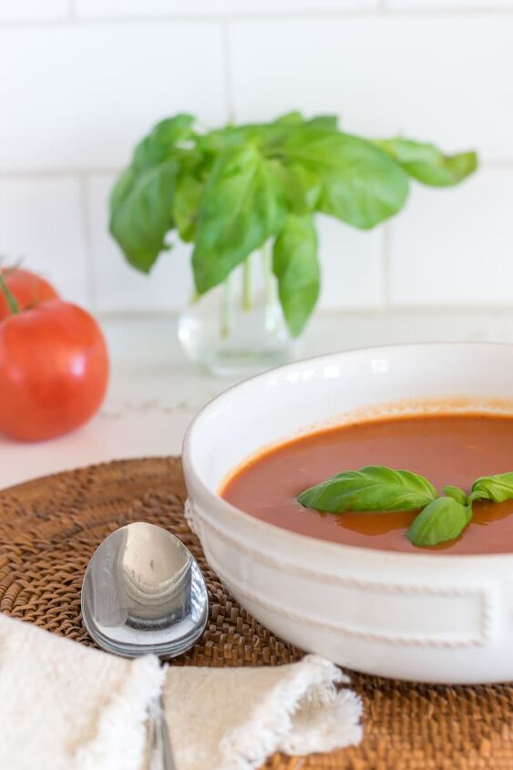 healthy homemade tomato soup very low fat, Healthy Homemade Tomato Soup in white bowl with fresh tomatoes and basil in the background