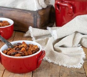crockpot turkey chili recipe healthy low fat, Hearty Crockpot Turkey Chili in a red bowl in front of a large red pot of chili