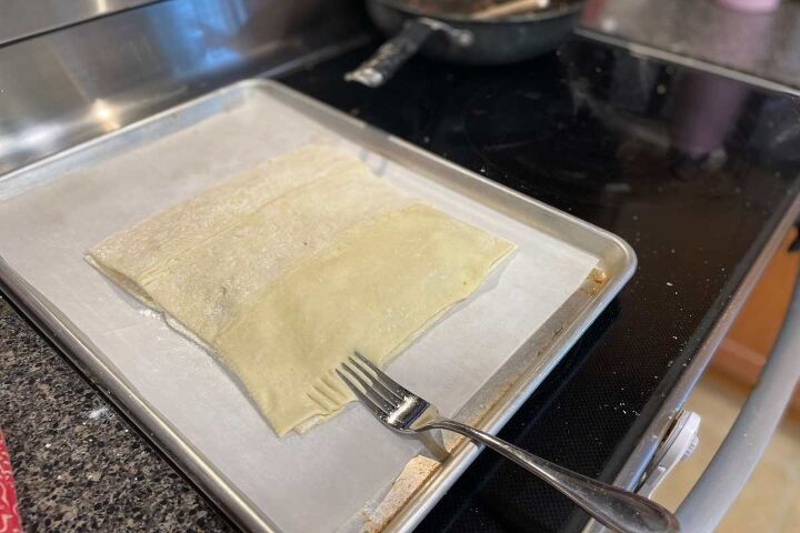 simple ground beef puff pastry recipe, Using a fork to crimp the puff pastry on the cookie sheet for Simple Ground Beef Puff Pastry
