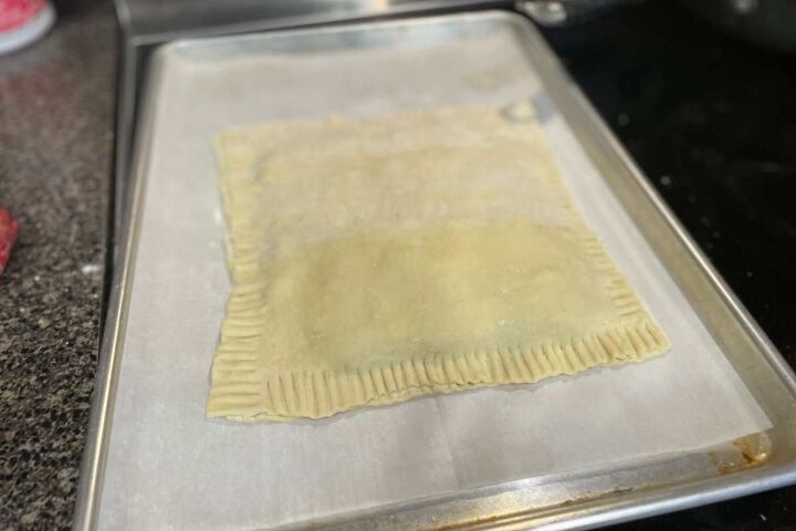 simple ground beef puff pastry recipe, Simple Ground Beef Puff Pastry with crimped edges on a cookie sheet still raw