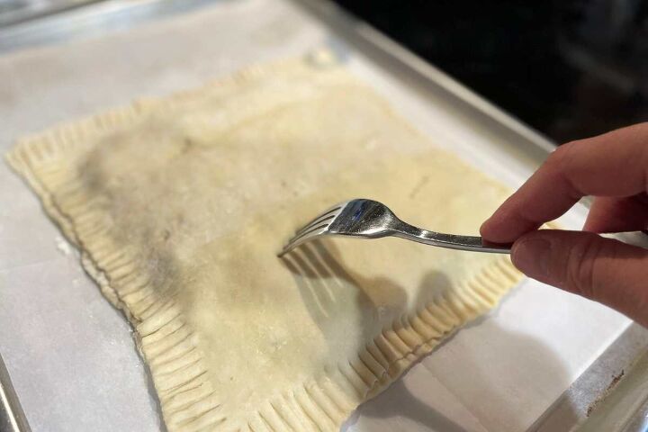 simple ground beef puff pastry recipe, Fork poking vent holes in the top of the Simple Ground Beef Puff Pastry