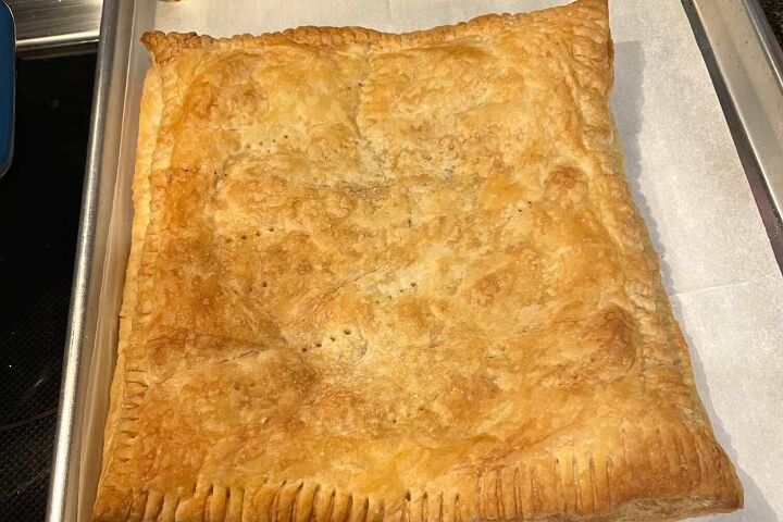 simple ground beef puff pastry recipe, Simple Ground Beef Puff Pastry whole and out of the oven on a cookie sheet with parchment paper