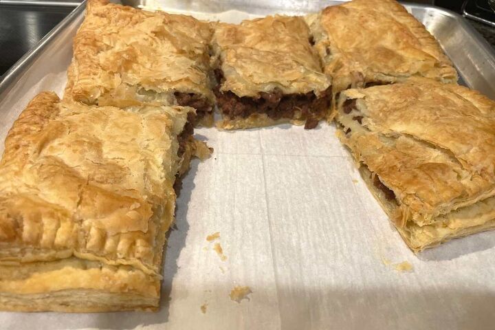 simple ground beef puff pastry recipe, Simple Ground Beef Puff Pastry out of the oven and sliced into 6 pieces with one piece missing