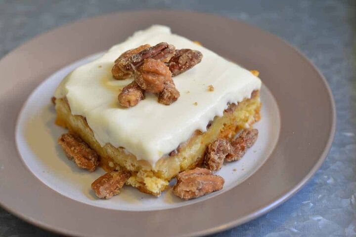 pumpkin crunch cake with yellow cake mix, Slice of pumpkin crunch with pecans on top on a plate