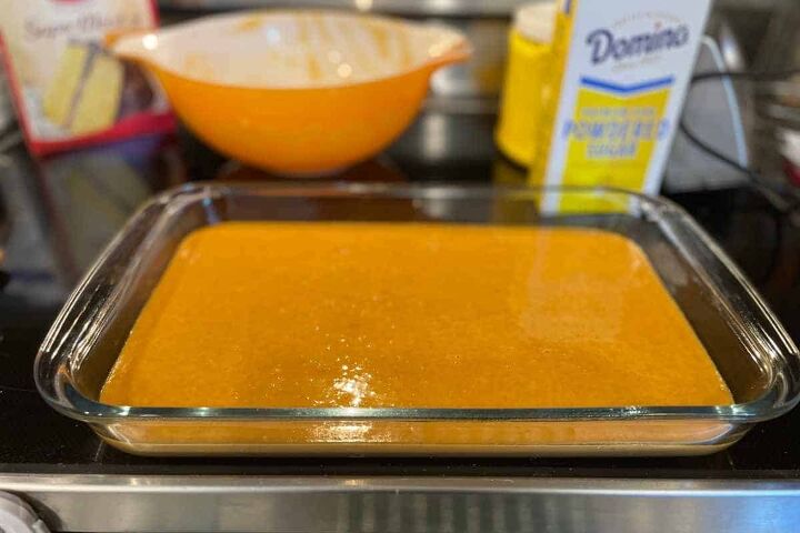 pumpkin crunch cake with yellow cake mix, the bottom unbaked layer of a pumpkin crunch recipe poured into a baking dish