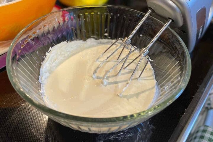 pumpkin crunch cake with yellow cake mix, cream cheese and heavy cream with an electric mixer for the icing for pumpkin crunch