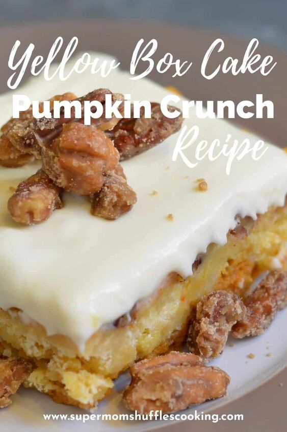pumpkin crunch cake with yellow cake mix, pumpkin crunch dessert close up with brown sugar pecans on top on a gray and white plate
