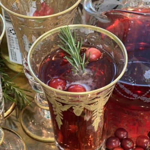 how to make delicious creamy tuscan sausage and bean soup, How to Make a Delicious and Elegant Cranberry Mimosa rosemary sprigs whole cranberries