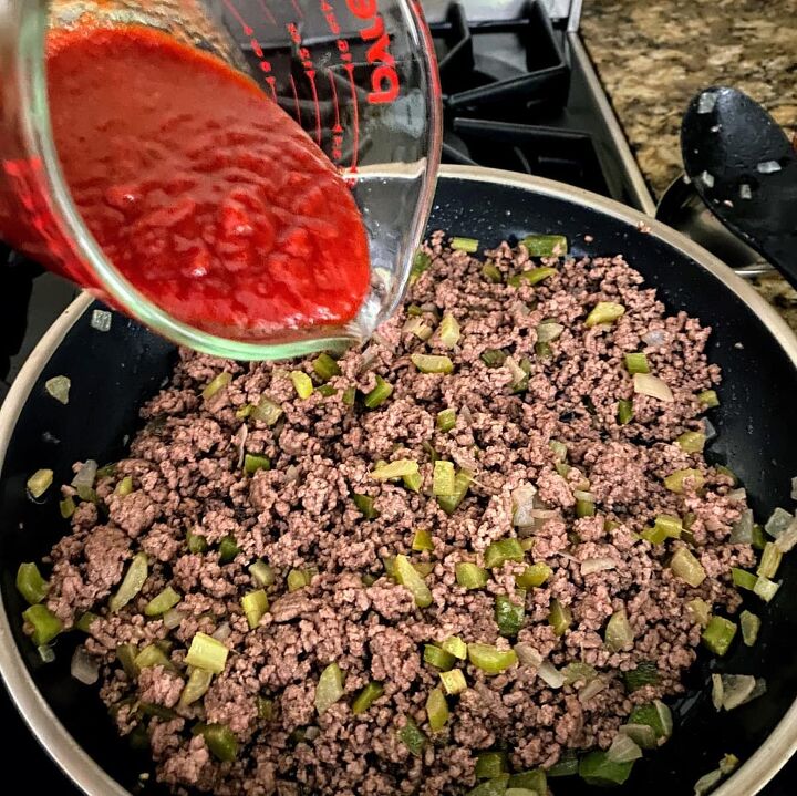 old fashioned sloppy joes recipe, adding chili sauce to meat and veggie mixture for old fashioned sloppy joes recipe