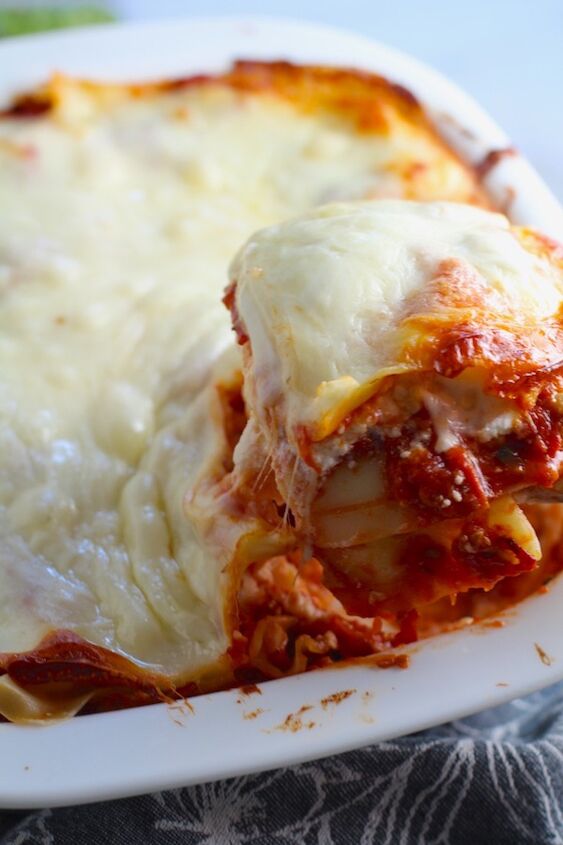 layered lasagna recipe with italian chicken sausage, Scooping a piece of Chicken lasagna from the dish This Italian Sausage Lasagne Recipe is the stuff that dreams are made of Layers of pasta creamy ricotta salty chewy mozzarella salty and hearty Italian Sausage and sweet and tangy tomato sauce