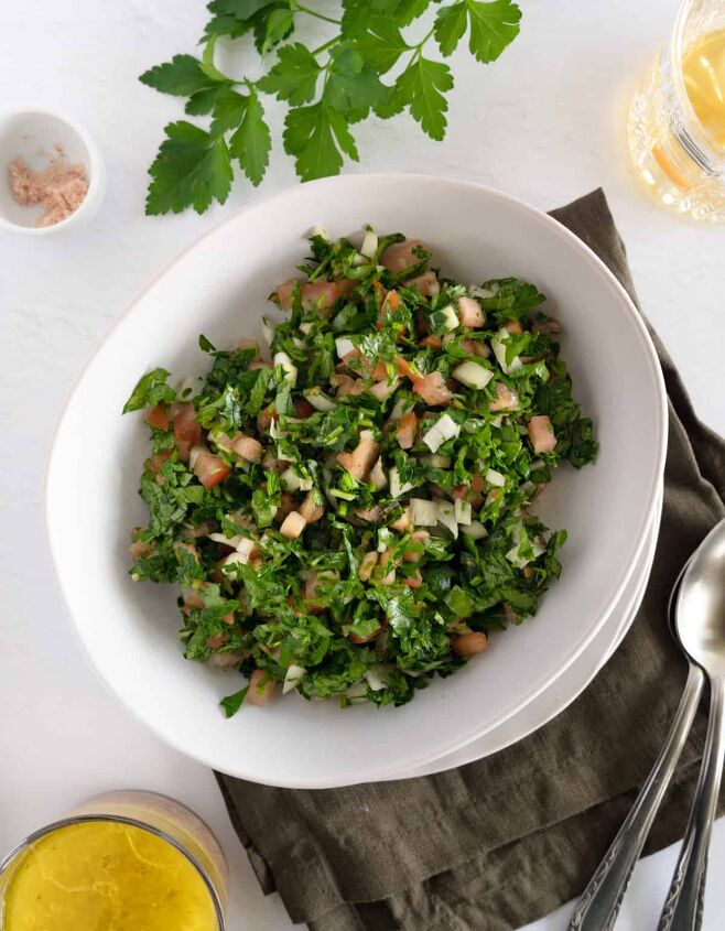 authentic lebanese taboule salad, taboule without burgul in a white bowl