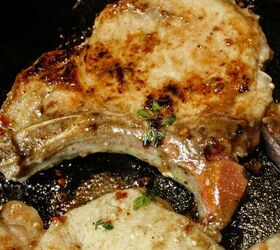pan seared maple pork chops, Pan Seared Maple Pork Chop photographed cooking in a cast iron Staub skillet the skillet is black there is a maple sauce on the pork chops