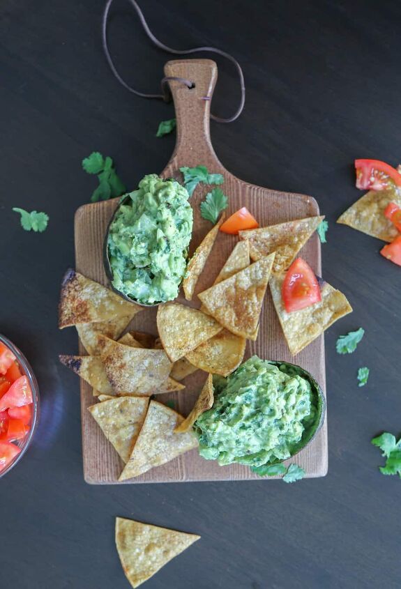 tasty guacamole recipe without tomatoes, guacamole recipe without tomatoes on a cutting board with homemade tortilla chips