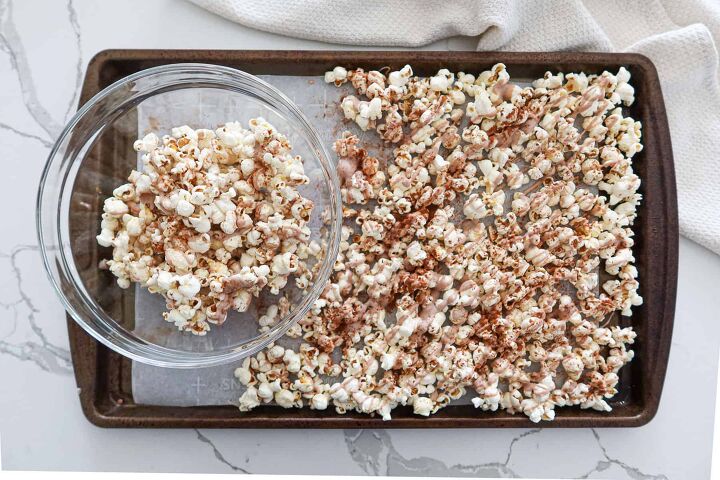 Breaking cinnamon popcorn into pieces and putting them in a bowl
