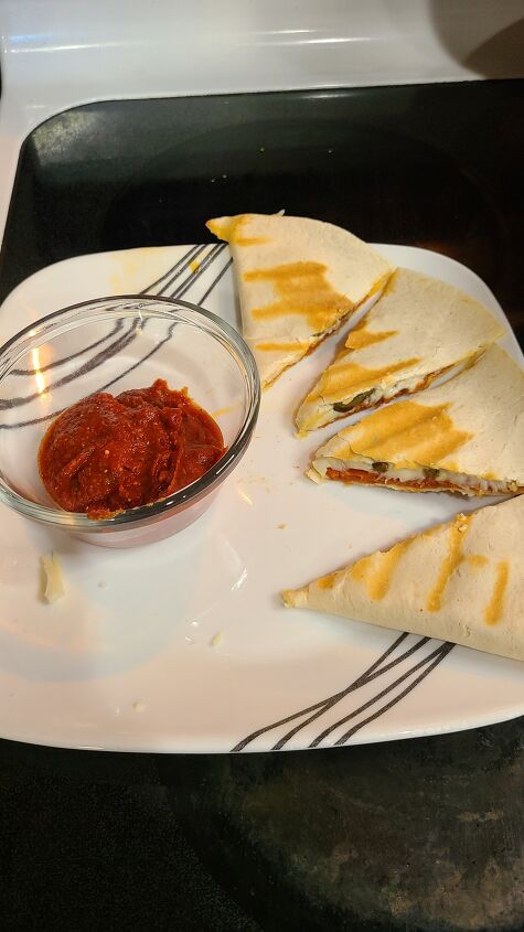 pizza quesadillas, Pizza quesadilla on a plate with a bowl of pizza sauce