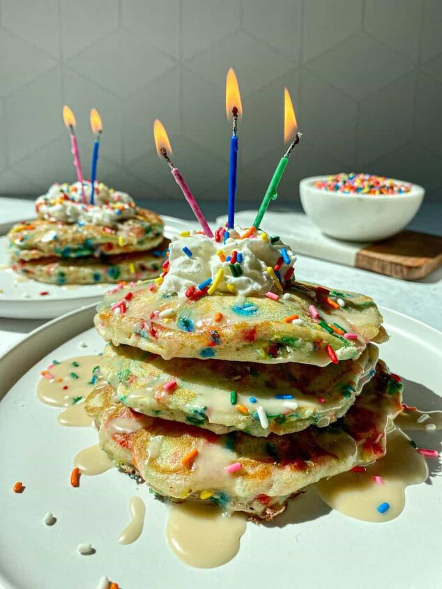 funfetti pancakes happy honey kitchen, Two stacks of sprinkles pancakes topped with whipped cream and birthday candles