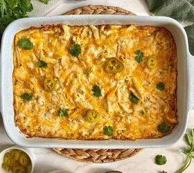 sour cream chicken enchilada casserole happy honey kitchen, Sour Cream Chicken Enchilada Casserole in a large baking dish A green kitchen towel cilantro avocado and chips are around the dish