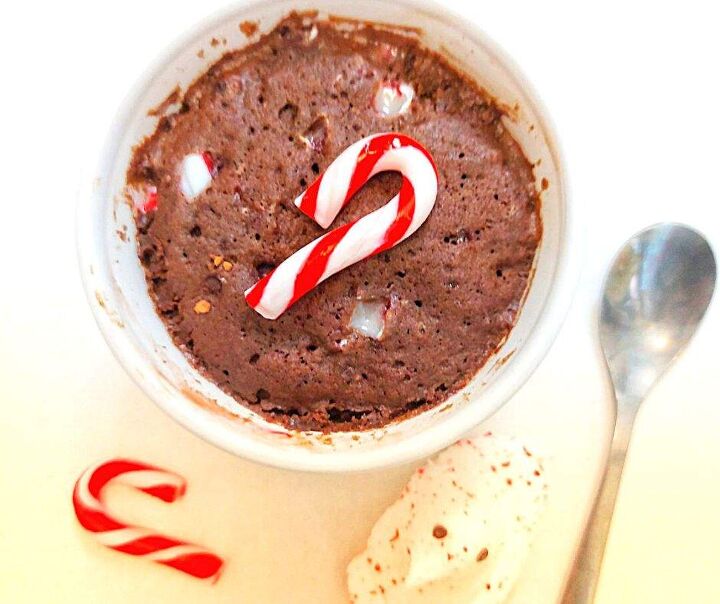 2 minute christmas mug cake the best chocolate candy cane cake in a m, Christmas mug cake topped with a candy cane