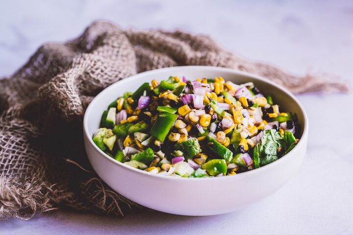 easy grilled corn salad, a large white ceramic bowl filled a rainbow corn salad