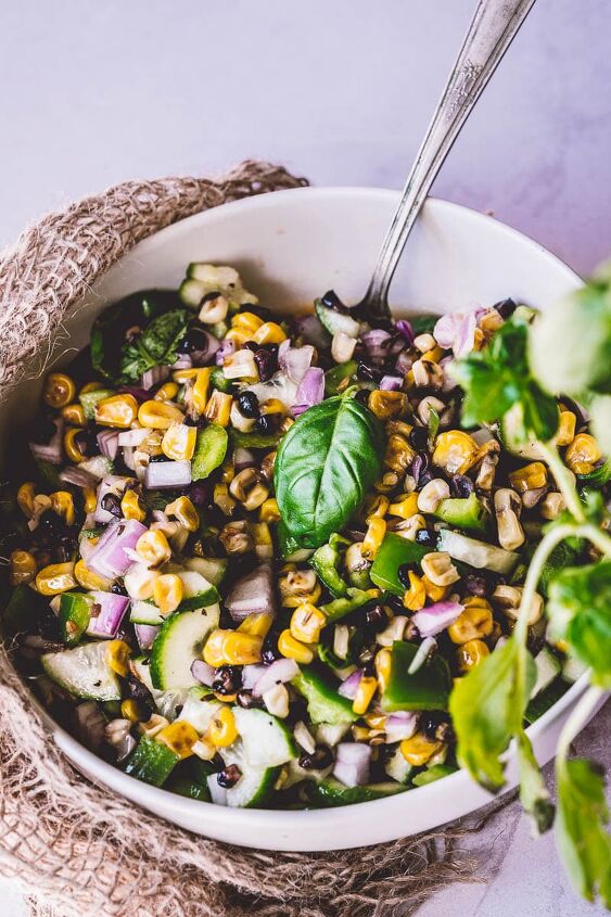 easy grilled corn salad, burlap surrounds a white ceramic bowl filled with stovetop grilled corn salad