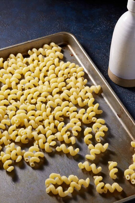 old fashioned macaroni and cheese recipe, Cooked pasta on a rimmed baking sheet