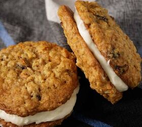 carrot cake cookies, Two carrot cake sandwich cookies propped up and laying on a napkin