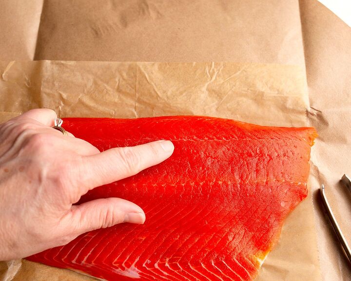 honey mustard salmon, A pointer finger pointing to the line where the bones are