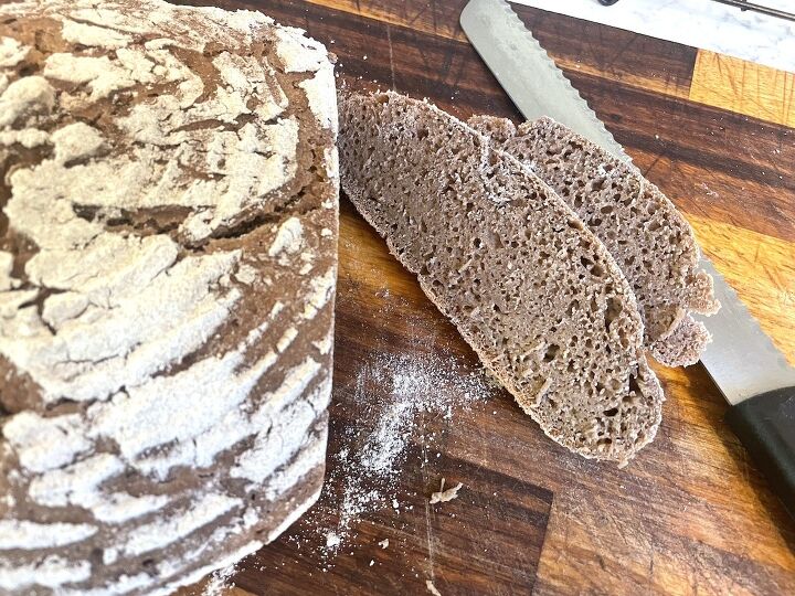 easy sourdough rye bread, slices and loaf of sourdough rye bread on cutting board with bread knife