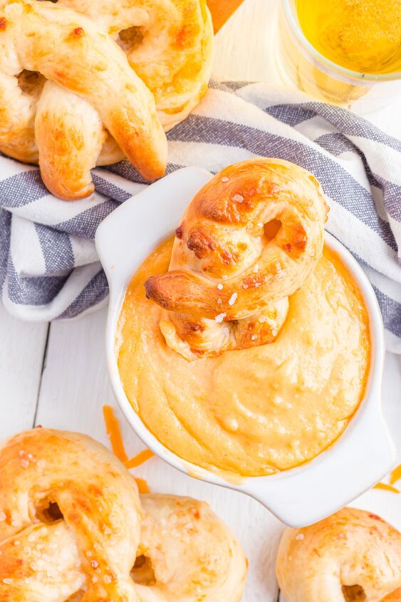 pretzel beer cheese dip, Soft pretzel dipped in a bowl of cheese dip