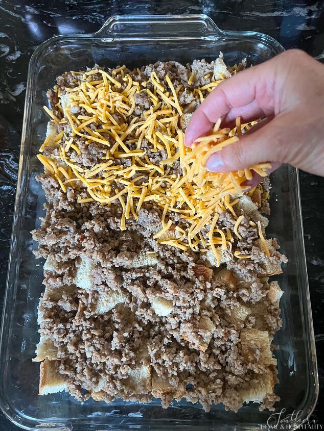 easy cheesy sausage and egg breakfast casserole make ahead in minutes, Sprinkling cheese over bread and sausage