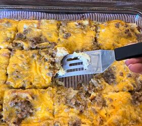 easy cheesy sausage and egg breakfast casserole make ahead in minutes, Sausage egg and cheese breakfast casserole cut into squares in the pan