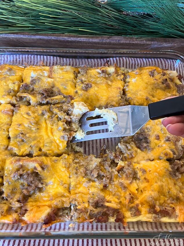 easy cheesy sausage and egg breakfast casserole make ahead in minutes, Sausage egg and cheese breakfast casserole cut into squares in the pan