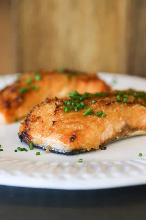 air fryer salmon with dijon mustard sauce, air fryer salmon with dijon mustard sauce on a plate with chives