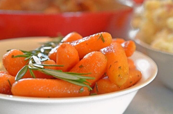 roasted rosemary buttered carrots, A bowl of roasted carrots with rosemary