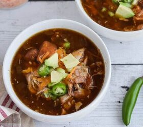 slow cooker mexican chicken soup, Slow Cooker Mexican Chicken Tortilla Soup with avocado jalapenos and cheese in two small white serving bowls crockpot