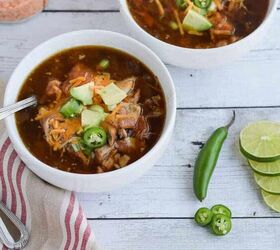 slow cooker mexican chicken soup, Slow Cooker Mexican Chicken Tortilla Soup with avocado jalapenos and cheese in two small white serving bowls crockpot glutenfree