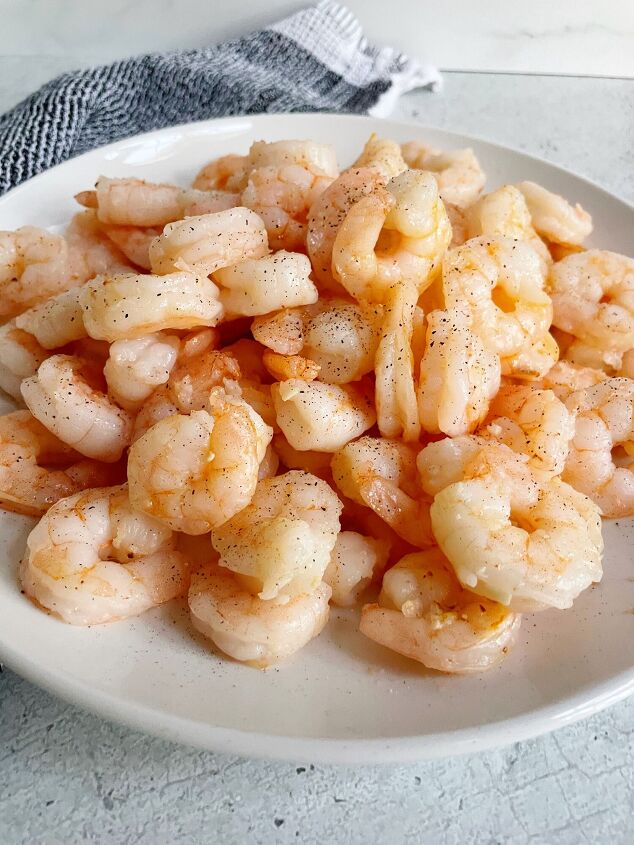 easy air fryer garlic butter shrimp, Easy Air Fryer Garlic Butter Shrimp on a white plate