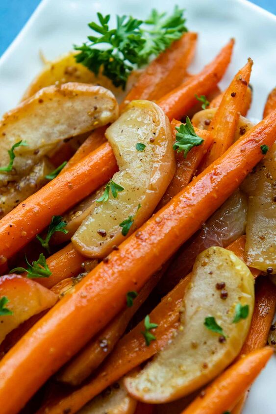 maple dijon glazed roasted carrots and apples, carrot apple side dish on a white plate