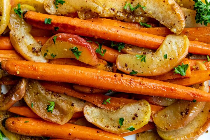 maple dijon glazed roasted carrots and apples, carrots and apples close up with parsley sprinkled on top