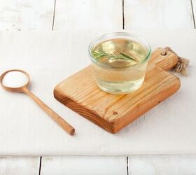 white wine sangria recipe with fresh herbs, Sugar syrup in a glass bowl on a white wooden background