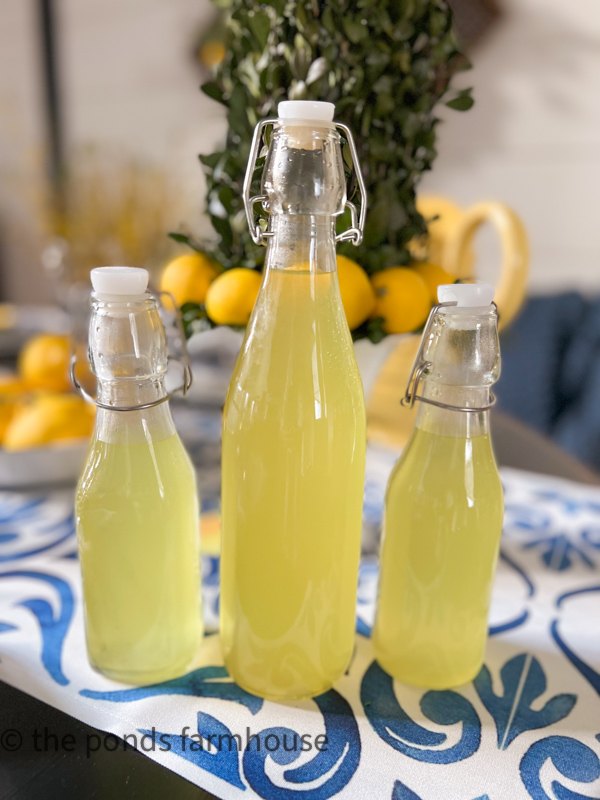 Limoncello Recipe stored in decorative bottles and kept in freezer
