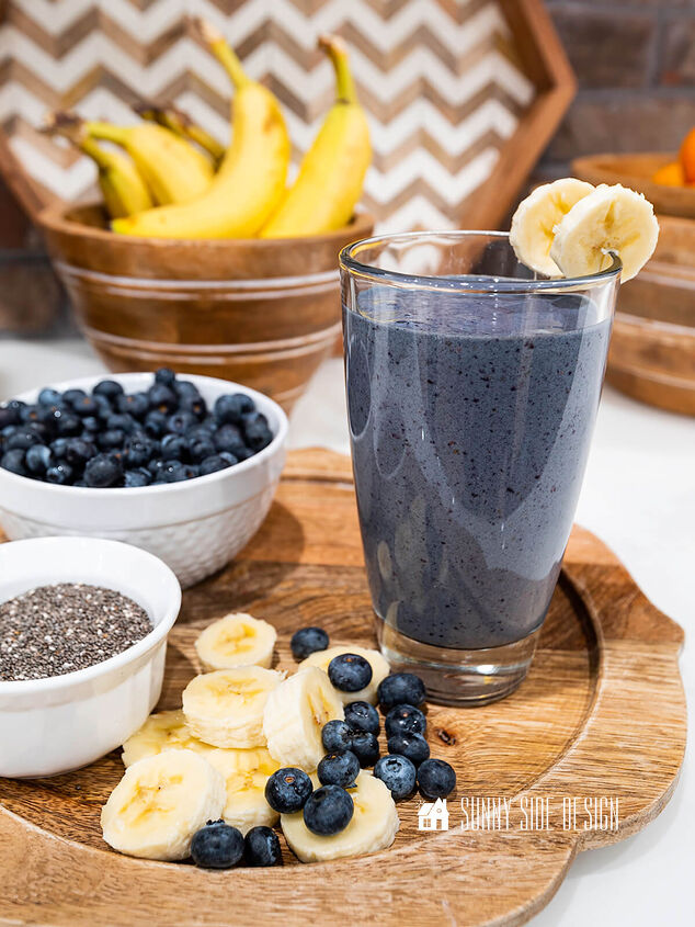 the best superfood blueberry banana smoothie, Healthy Blueberry Banana Smoothie on a wooden tray with fresh blueberries bananas and chia seeds