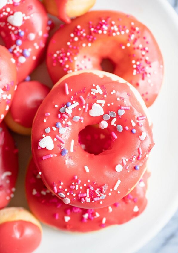 valentine donuts in air fryer basic recipe, donuts sprinkled with red glaze and heart sprinkles