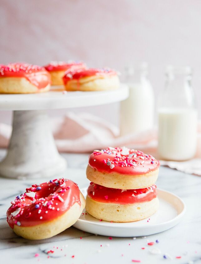 valentine donuts in air fryer basic recipe, stacked red glazed donuts on a white plate