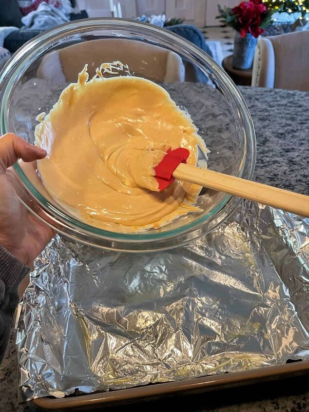 tiger butter fudge recipe easy, pouring the white chocolate and peanut butter mixture into the greased baking dish