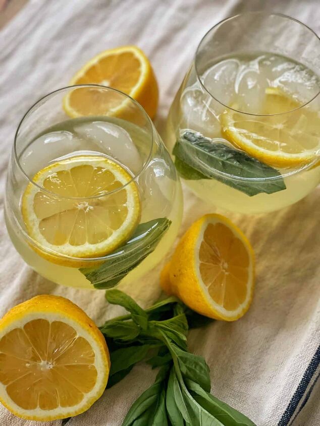 3 white wine spritzer recipes you should try, Lemon basil spritzer recipe in stemless wine glasses on farmhouse dish towel